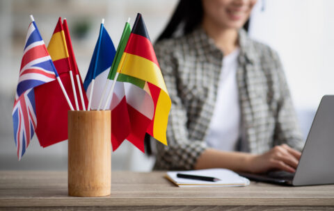 Cropped,Of,Asian,Young,Woman,Foreign,Language,Teacher,Sitting,At